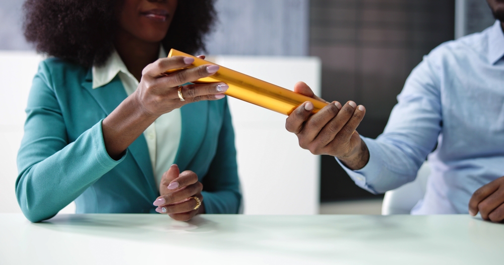 Business,Man,And,Woman,Relay,Baton,Handover,And,Pass