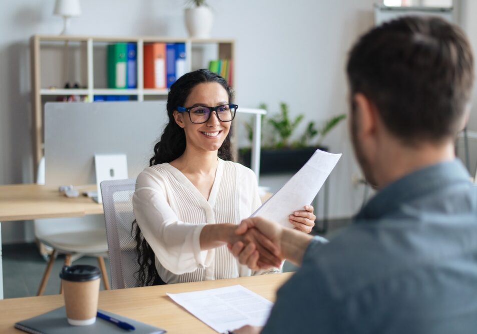 Smiling,Female,Personnel,Manager,And,Job,Applicant,Shaking,Hands,After